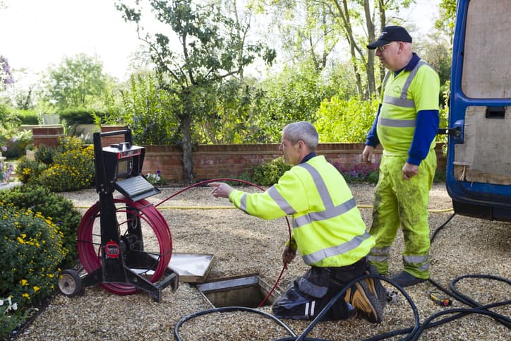 Drain Workers Inspecting Drains